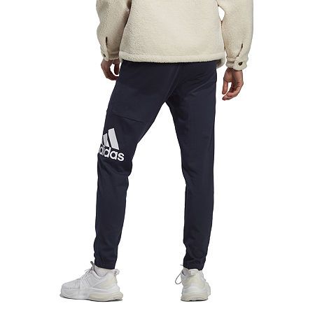 Slip on this pair of joggers from adidas for an off-duty day hanging with friends or lounging at home. They are made from soft cotton-jersey with an elastic-drawstring waistband, side and back pockets, and complete with the brand's iconic graphic logo along the side.Front Style: Flat FrontFeatures: Drawstring, Drawstring WaistClosure Type: Full ElasticFit: Regular FitPockets: 2 Side Slip Pockets, 1 Back Slip PocketRise: Mid RiseFiber Content: 100% CottonFabric Description: JerseyInseam: 29 3/4 I Relaxed Fit Athleisure Adidas Joggers, Adidas Athleisure Joggers For Loungewear, Cotton Relaxed Fit Pants With Adidas Logo, Relaxed Cotton Adidas Pants, Adidas Relaxed Fit Sweatpants For Sports, Adidas Logo Sweatpants For Training, Adidas Cotton Jogging Pants, Adidas Logo Cotton Jogging Pants, Cotton Adidas Logo Pants For Jogging