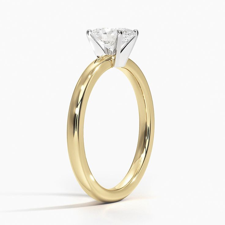 Oval Shaped 2mm Comfort Fit Solitaire Engagement Ring - 18K Yellow Gold. This classic four-prong solitaire engagement ring has a rounded inside edge for increased comfort. Gold Solitaire Ring Classic Cut, Modern Solitaire Yellow Gold Wedding Ring, Modern Yellow Gold Solitaire Wedding Ring, Elegant Gold Diamond Ring With Classic Cut, Elegant Gold Diamond Ring Classic Cut, Refined Gold Solitaire Ring, Elegant Yellow Gold Ring With Classic Cut, Luxury Ring With Single Diamond Classic Cut, Luxury Ring With Single Diamond In Classic Cut