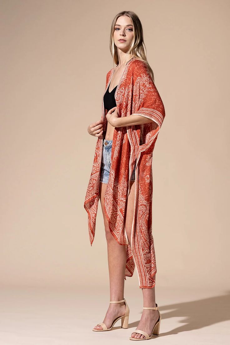 A gorgeous damask and paisley print adds a vintage touch to this kimono. A mid-length style featuring kimono sleeves, side slits, and an open front. Ultra-lightweight and soft, this effortless coverup is a must-have for a day at the beach or pool. Relaxed Fit 100% Viscose Hand Wash Cold, Dry Flat Kimono Sleeves Lightweight Fabrication Open Front No Closures Not Lined Length 57” from shoulder to hem Party Bottoms, Open Front Kimono, A Day At The Beach, Kimono Sleeves, Sweater Crop, Print Kimonos, Dresses By Length, Crop Top Sweater, Day At The Beach