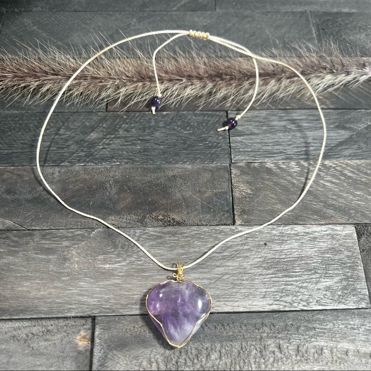 Beautiful Purple Amethyst Heart Pendant Necklace. This Beautiful Wire Wrapped Heart Necklace Is Handmade Using Gold Wire, 0.8 Mm Waxed Polyester Cord Waterproof! Amethyst Round Beads Finished With A Sliding Macram Knot. This Necklace Makes A Great Gift!! Length Is 24” Bohemian Purple Necklace With Heart Beads, Adjustable Purple Jewelry With Heart Charm, Adjustable Purple Necklaces With Heart Beads, Purple Double Heart Jewelry With Heart Charm, Purple Double Heart Charm Jewelry, Heart Shaped Amethyst For Jewelry Making, Heart-shaped Amethyst For Jewelry Making, Purple Double Heart Jewelry For Gifts, Purple Double Heart Jewelry Gift