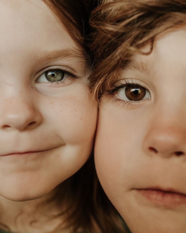 two young children are smiling for the camera