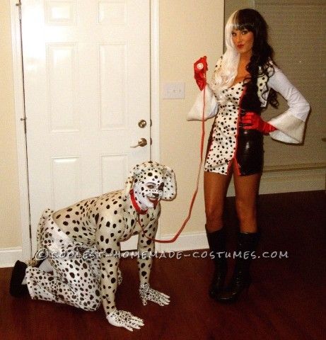 a woman in costume standing next to a dalmatian dog