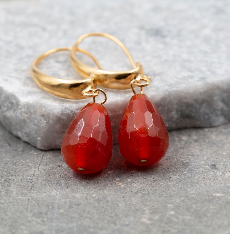 Treat yourself or a loved one with these gorgeous drop earrings. Made with lovely Carnelian stones and a contemporary design to go with your evening and daytime looks. These Carnelian earrings for women are made stunning with the combination of gold and orange color of the stone. Wear and style with other 14k jewelry pieces. Product Details: --------------------- Material: --------------------- Gold plated over brass (Nickel-free) Measurements: --------------------- Length of the whole earring - Carnelian Gemstone Dangle Earrings, Gold Carnelian Gemstone Earrings, Elegant Carnelian Drop Earrings, Elegant Carnelian Teardrop Earrings, Elegant Carnelian Earrings For Gift, Elegant Carnelian Earrings Gift, Amber Carnelian Teardrop Earrings, Carnelian Drop Earrings As Gift, Carnelian Drop Earrings For Gift