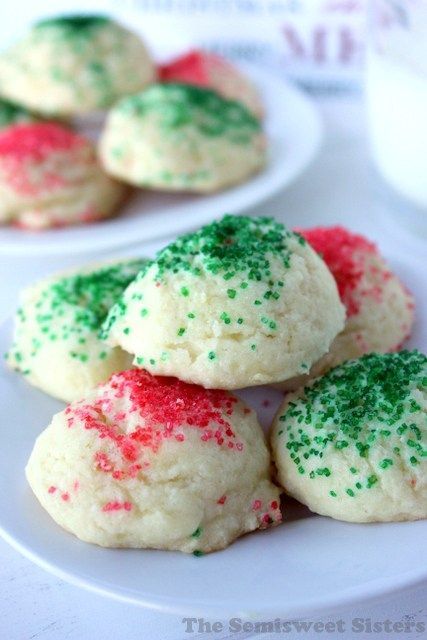 small cookies with green and red sprinkles on white plates