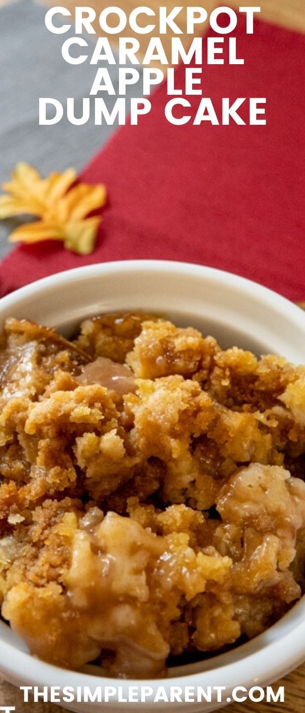 crockpot caramel apple dump cake in a white bowl on a wooden table