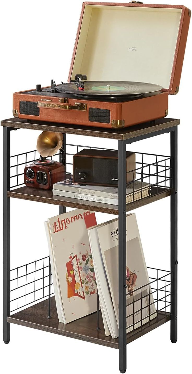 an old record player on top of a shelf with books and records in it's bins