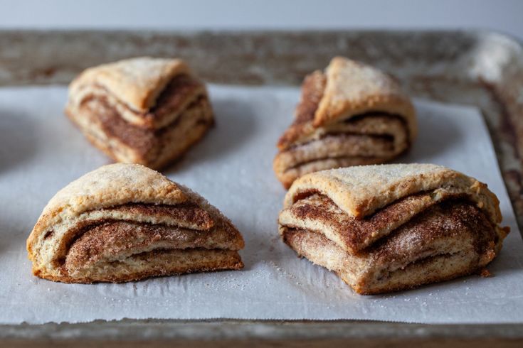 several pastries are stacked on top of each other and ready to be eaten in the oven