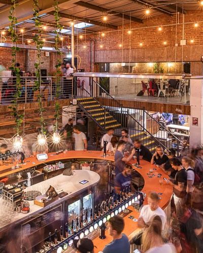 an overhead view of a crowded restaurant with lots of people