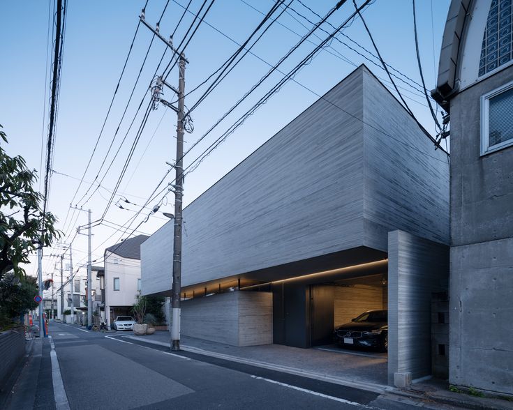 an empty street with cars parked in the garage