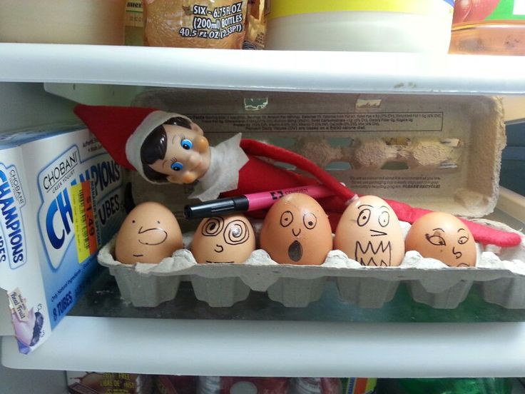 an elf is in the fridge with eggs