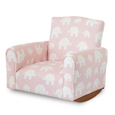 a pink and white chair with an elephant print on the armrests, sitting in front of a white background