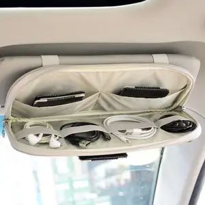 the inside of an airplane with earbuds and headphones in its compartment,