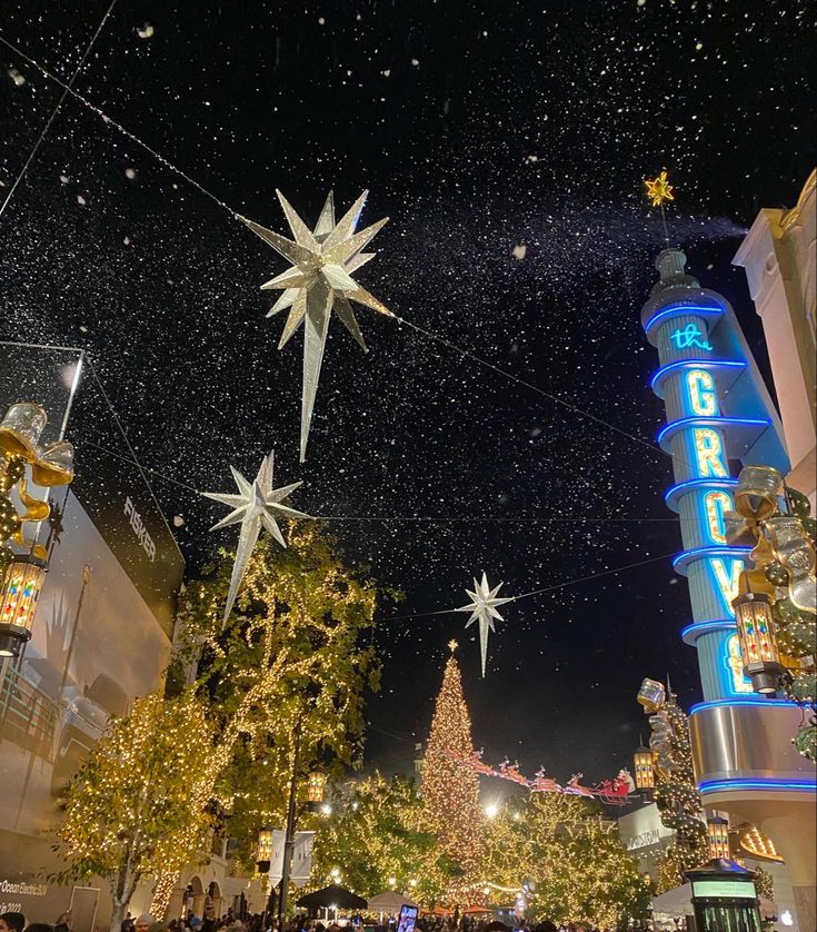 christmas lights and decorations adorn the streets of an upscale shopping district in las vegas