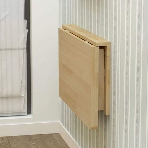 a wooden cabinet mounted to the side of a wall