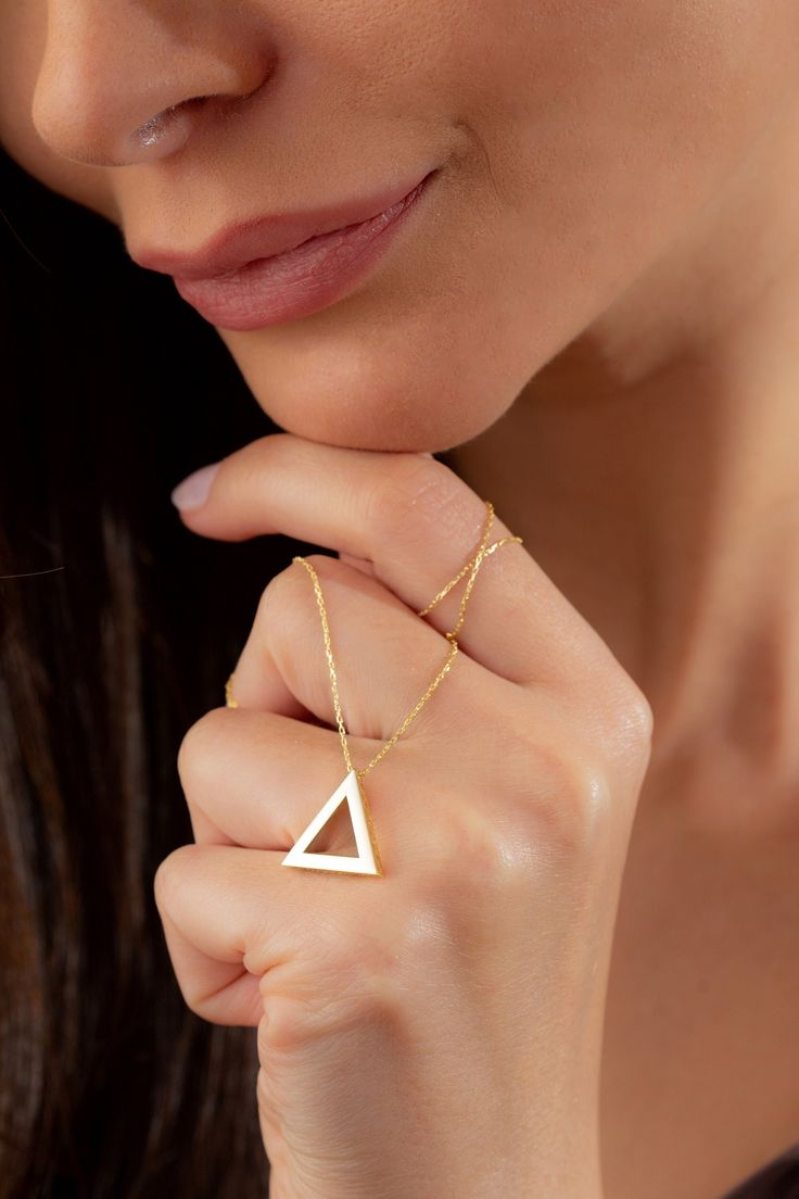 Dainty Gold Triangle Geometric Necklace, 14k 18k 10k Minimalist Gold Necklace, Christmas Gift for Her, Teacher Appreciation Gift Jewelry FEATURES * Solid Gold (real gold, not gold plated or gold filled material) * Gold Karat: 10K (417) - 14K (585) - 18K (750) (optional) * Pendant Height 0.62 Inches (1.58 cm) * Pendant Width 0.68 Inches (1.72 cm) Our gold necklaces are perfect choice for a Christmas, Mother's Day, valentine's day, birthday, wedding, anniversary, graduation, engagement, bridesmaid Gold Triangle Jewelry For Formal Occasions, Simple 14k Gold Necklaces, Modern 14k Yellow Gold Filled Necklaces, Modern 14k Gold Filled Yellow Gold Necklace, Modern 14k Gold-filled Yellow Gold Necklace, Minimalist Triangle-shaped Jewelry For Gifts, Minimalist Triangle Jewelry For Gifts, Elegant Triangle Yellow Gold Jewelry, Minimalist Triangle Jewelry For Formal Occasions