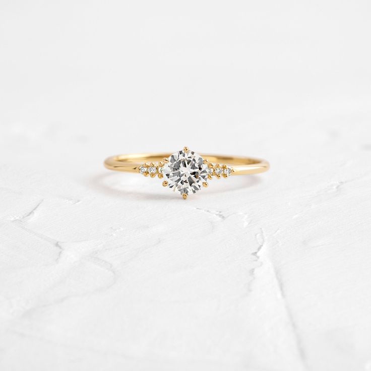 Poppy Seed Ring | Handcrafted Diamond Engagement Ring | Melanie Casey Simple Low Profile Engagement Rings, Dainty Promise Cluster Ring With Prong Setting, 14k Gold Cluster Ring With Round Cut For Promise, 14k Gold Cluster Ring With Single Diamond, 14k Gold Round Cut Promise Cluster Ring, Dainty Cluster Ring With Round Band, Dainty Cluster Ring With Round Band For Promise, Dainty Round Cut Cluster Promise Ring, Dainty Cluster Ring For Promise