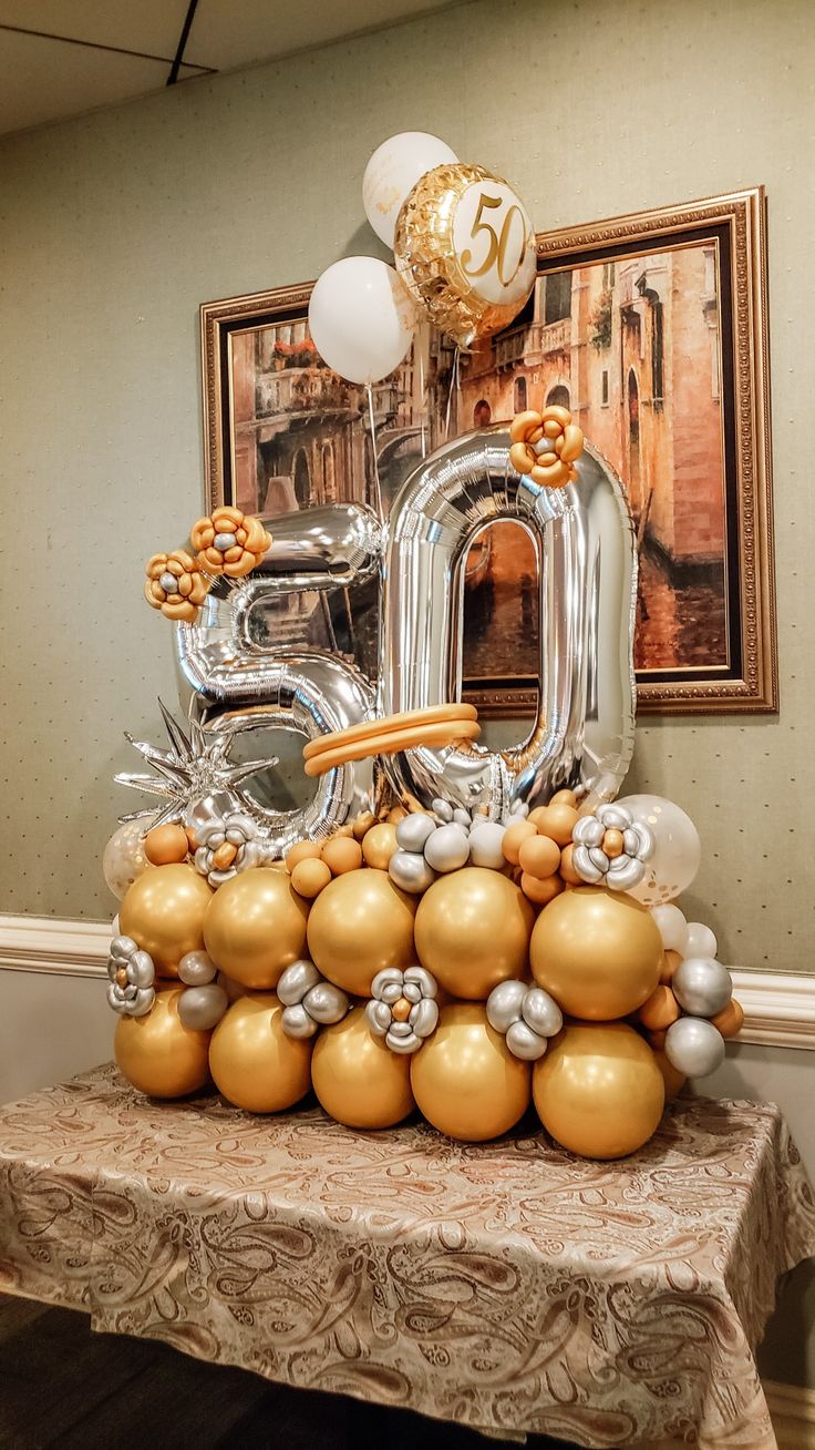 Gold & Silver 50th Anniversary Balloon Bouquet with silver 40 inch "5" & "0" over a base of gold balloons. 55 Balloon Bouquet, 80 Balloon Bouquet, 80 Birthday Balloons, 60th Balloon Bouquet, 50 Anniversary Balloon Decorations, 50th Balloon Centerpieces, 50th Balloon Ideas, Balloon Ideas For Men, 60 Balloon Decorations