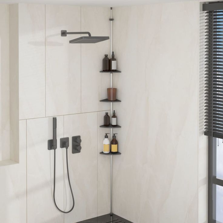 a bathroom with a shower head and shelves on the wall