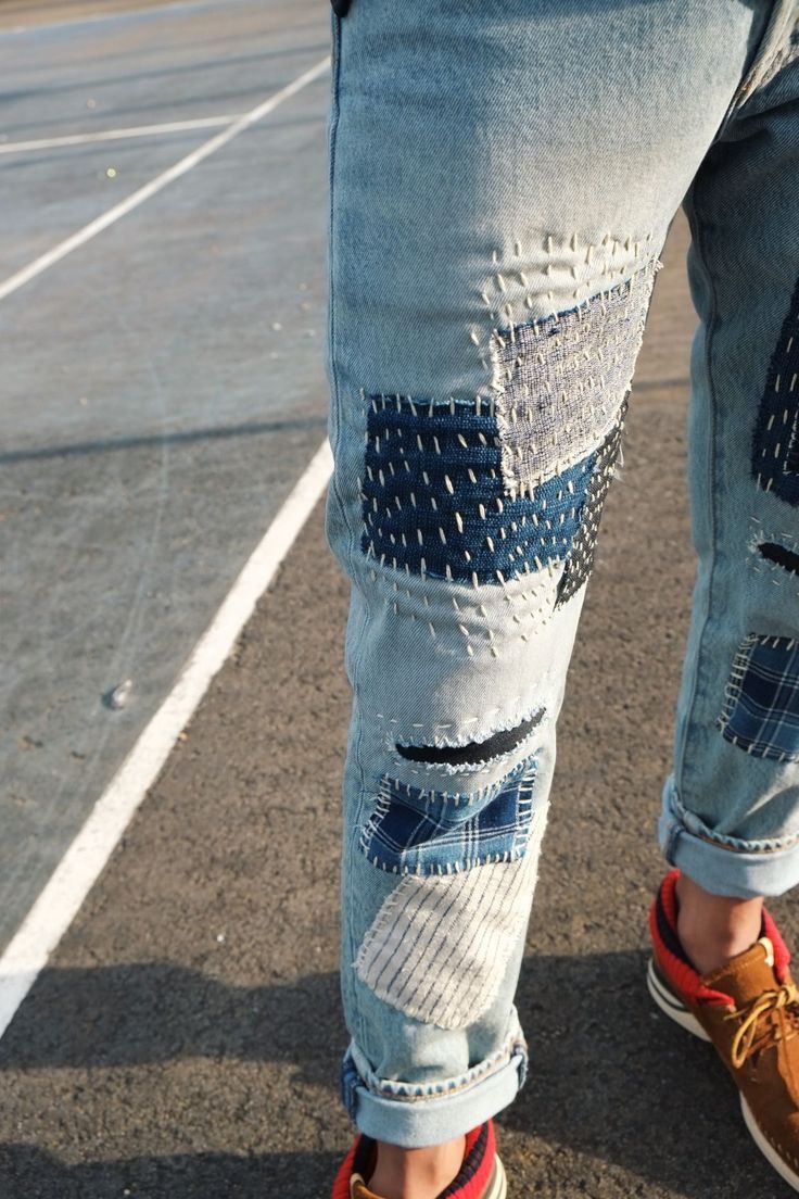 a person standing in the middle of a parking lot with their feet on a skateboard