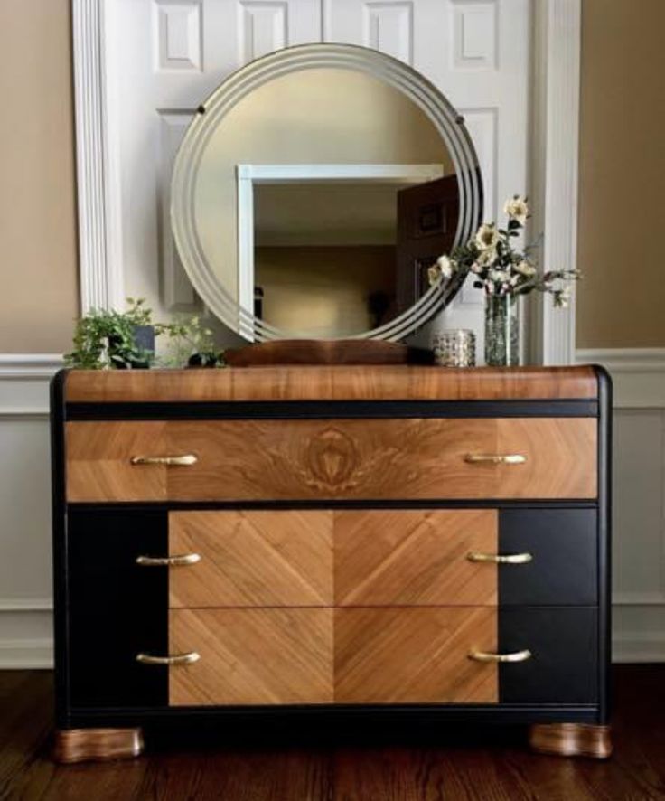 a dresser with a mirror on top of it