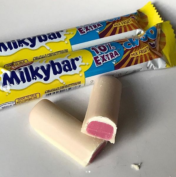 two bars of milkybar are sitting next to each other on a white surface