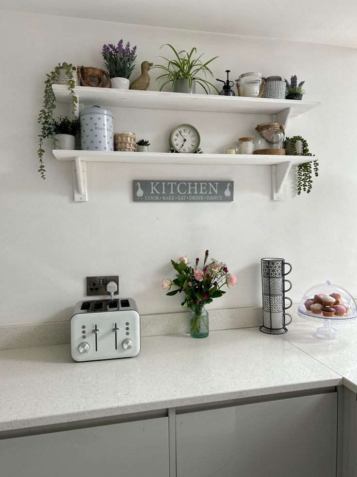 My open shelves in the kitchen. What do you think? After recently admiring open shelving inspo pics, I started thinking of adding some into our kitchen. A few clicks later and I had ordered 2 pine shelving kits from amazon. Once arrived I painted them white and fixed them onto the wall. Im actually thrilled with the result and I like that I can change what I put on them depeding on the season. So as my mood changes so may my shelves. Should I add some fairy lights or too much? Pine Shelving, Shelves In The Kitchen, Wall Shelf Brackets, Rustic Wooden Shelves, Shelf Board, Pine Walls, Open Kitchen Shelves, Mood Changes, Wood Wall Shelf