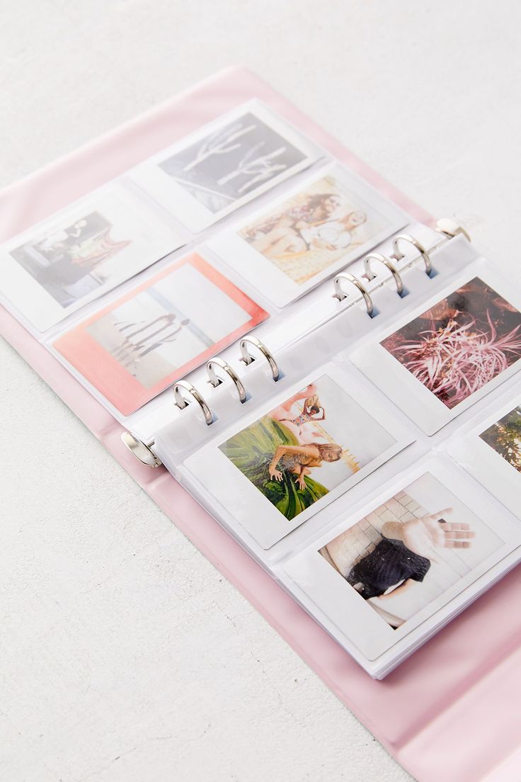 a pink binder with photos on it