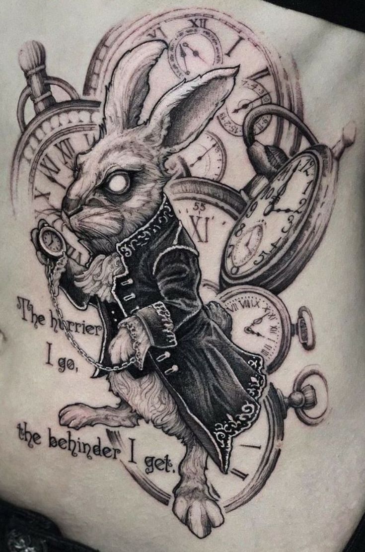 a woman's stomach with a rabbit and clock tattoo on the side that says, the internet is the bed under i get