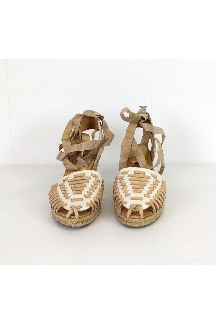 Slip into these romantic wedges. Designed with a ribbon lace-up style and woven front. Espradrille wedge heels gives them a unique touch. Size 6 Leather upper Rubber sole Ribbon lace-up style Espradrille heel Woven front Light outsole wear Heel height 2.75" Casual Lace-up Wedge Sandals With Woven Sole, Beige Wedge Espadrilles With Wrapped Heel, Beige Espadrilles With Wrapped Wedge Heel, Beige Closed Toe Wedge Sandals With Wrapped Heel, Beige Heels With Woven Sole And Flat Heel, Beige Lace-up Espadrilles With Woven Sole, Brown Straw Heels With Round Toe, Beige Round Toe Wedge Sandals With Woven Sole, Beige Platform Lace-up Sandals