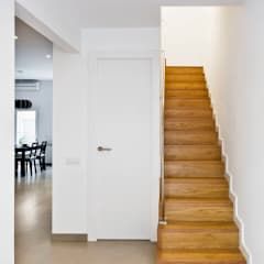 an empty room with stairs leading up to the door