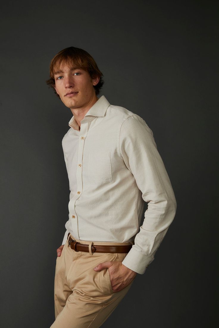 Introducing the Woven Oxford Shirt in Tan and Off White - a timeless and versatile addition to any wardrobe. Crafted using 100% organic cotton fabric, this shirt is lightweight and breathable, ensuring maximum comfort throughout the day. The subtle tan hue with off-white gives it a classic and sophisticated textural look, while the imitation mother-of-pearl buttons lend a touch of luxury to the overall design. This shirt has been exquisitely crafted to ensure a comfortable fit, making it perfect Cream Cotton Button-up Shirt, Beige Spread Collar Shirt For Everyday, Everyday Beige Shirt With Spread Collar, Beige Everyday Shirt With Spread Collar, Daily Beige Shirt With Spread Collar, Cream Cotton Shirt With Spread Collar, Beige Button-up Shirt For Casual Gatherings, Beige Cotton Shirt For Business Casual, Timeless Long Sleeve Cotton Shirt