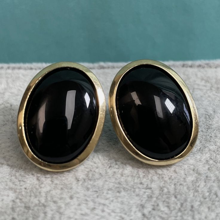 "Black and gold go with pretty much everything, so these earrings transition easily from day to night. They are natural black onyx bezel set in 14K yellow gold. The onyx are tablet cut and have a rounded cabochon top and flat back. Each oval earring is just over 3/4\" x 5/8\" wide Marked KFI 14KP 7.34g" Onyx Earrings, Oval Earring, Earrings Vintage, Estate Jewelry, Black Onyx, Black And Gold, Jewelry Earrings Dangle, Onyx, Dangle Drop Earrings