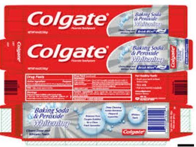 two packs of colgate toothpaste sitting on top of each other