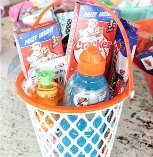 an orange basket filled with snacks and drinks