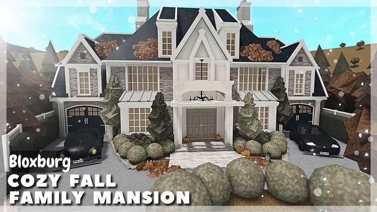 a large white house with lots of trees and rocks in front of it that says cozy fall family mansion