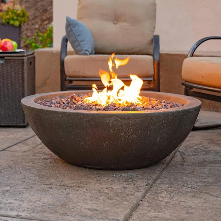 a fire pit sitting on top of a patio