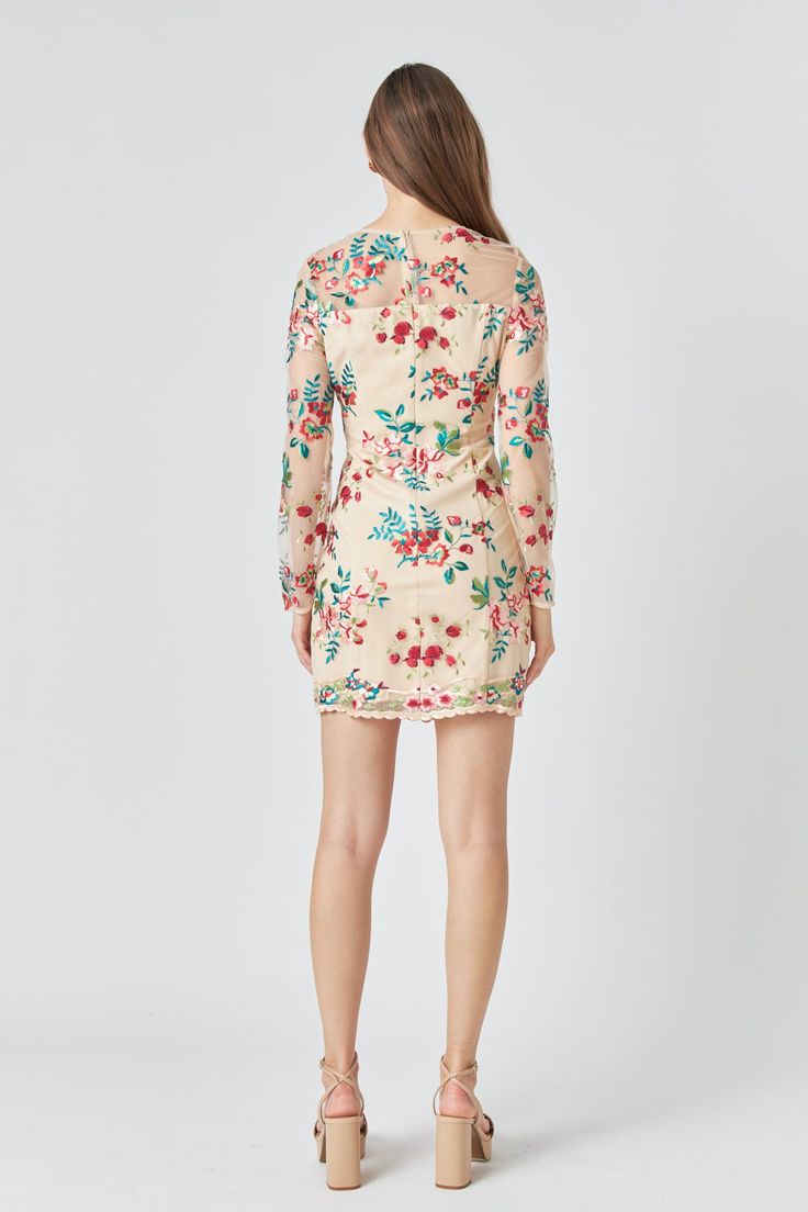 This stylish mini dress features an eye-catching floral embroidery a flattering fitted silhouette and long sleeves for a sophisticated feminine look. Perfect for special occasions and elegant evenings out. Floral embroidery Mini length Fitted Long sleeves Round neckline Pom Pom trims Back zipper Lining Hand wash cold Do not bleach Do not tumble dry Iron low Shell: 100% Polyester Contrast: 100% Nylon Lining: 95% Polyester 5% Spandex Exclusive of Decoration HN1773D Total length: 34.5 " Bust: 34" X Elegant Floral Applique Mini Dress For Cocktail, Elegant Cocktail Mini Dress With Floral Applique, Elegant Floral Applique Mini Dress, Elegant Mini Dress With Floral Applique, Elegant Mini Length Dress With Floral Applique, Elegant Floral Applique Mini Dress For Garden Party, Floral Embroidered Knee-length Cocktail Dress, Cocktail Floral Embroidered Knee-length Dress, Cocktail Knee-length Floral Embroidered Dress