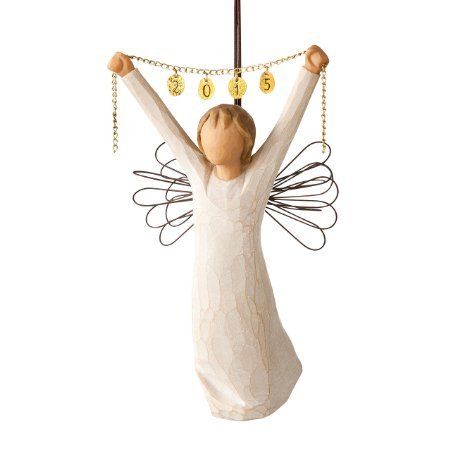 an angel figurine hanging from a pole with coins on it's back