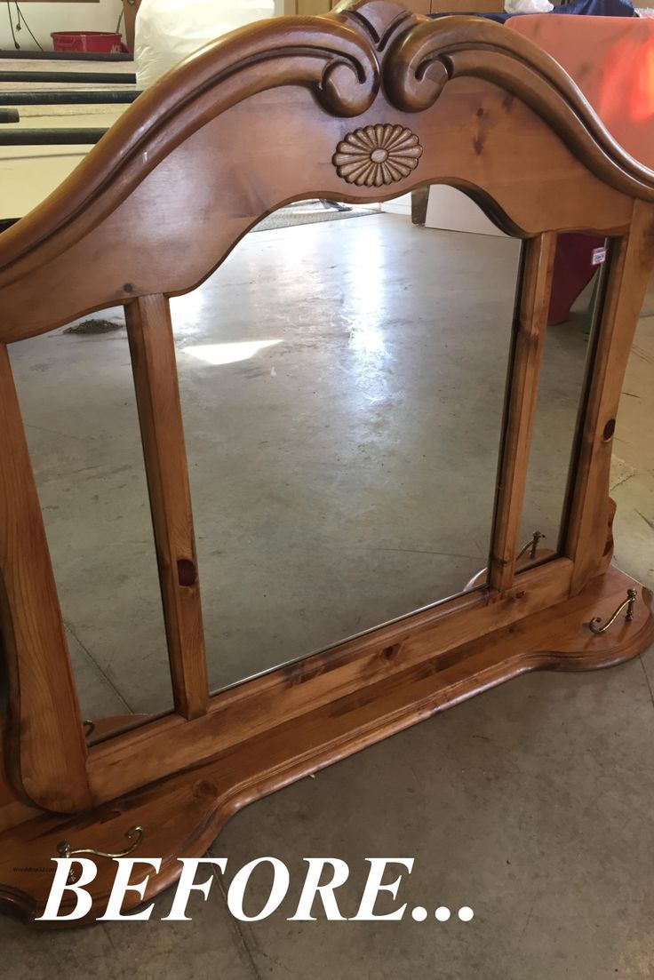 a mirror that is sitting on top of a wooden stand with the words before it's painted