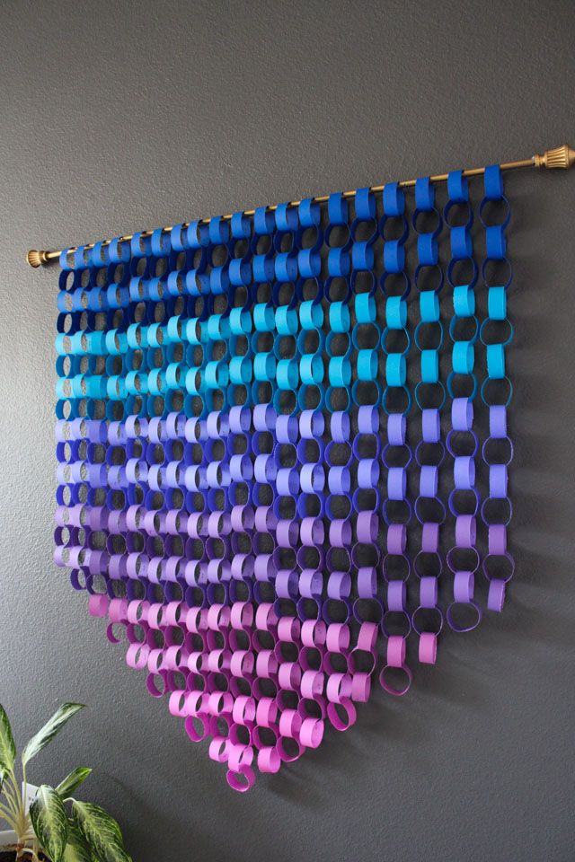 a wall hanging made out of plastic cups