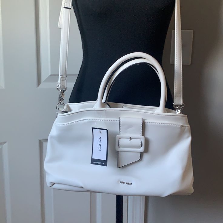 Style Nyn50i806 One Big Zipper Pocket In The Middle Two Pockets For Cards And An Extra Zipper Pocket In The Other Side 8” Tall. 13” Bottom White Satchel With Adjustable Strap For Work, White Shoulder Bag With Zipper For Work, White Satchel Shoulder Bag For Work, White Shoulder Satchel For Work, White Bag With Adjustable Strap For Work, White Satchel With Detachable Strap For Work, White Bags For Workwear In Spring, White Spring Bags For Workwear, White Bags For Workwear And Spring