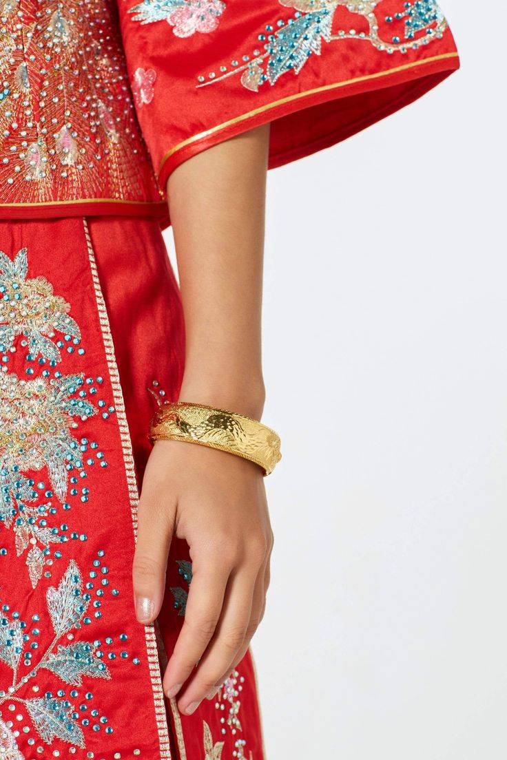 Adorn those plain wrists with a bit of gold to help complete your cheongsam look! Easy to put on and remove, this bangle also pairs nicely with our Phoebe dress. *These bangles run a bit smaller (21cm circumference). Please check your wrist measurements.* Festive Bangle Cuff Bracelet, Festive Ceremonial Bangle, Ceremonial Cuff Bracelet For Festivals, Elegant Ceremonial Cuff Bangle, Ceremonial Festival Cuff Bracelet, Festivals Gold Bangle Bracelet, Festival Gold Bangle Bracelet, Traditional Gold Bracelet For Formal Occasion, Ceremonial Festive Gold Bangle Bracelet