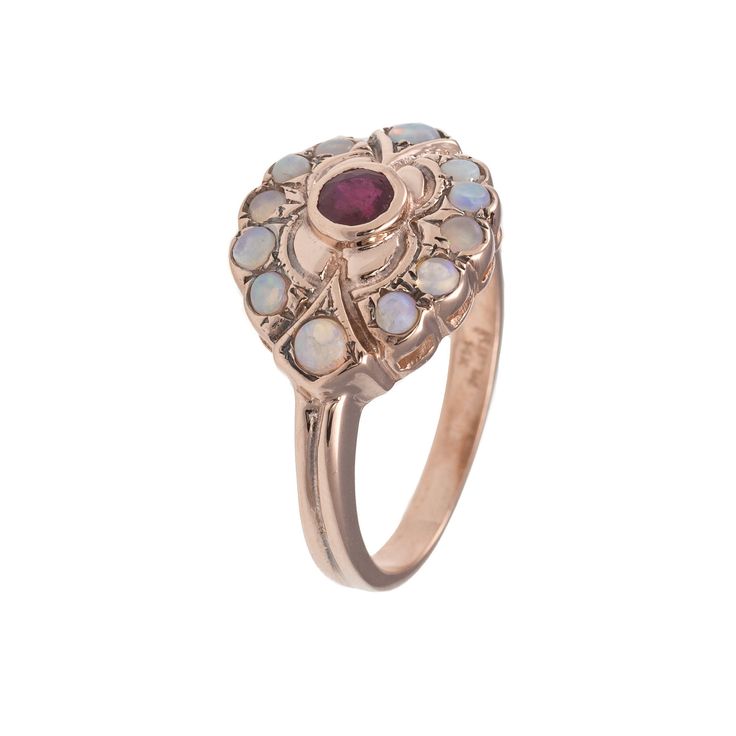 Delicate Ruby and Opal Ring set it our custom 14K Solid Rose Gold Details and Measurements: ► 14 Karat Rose Gold ► Central Ruby 4 mm ► 12 Opal 2.5 mm ► Size 7.75 (Select your size) ► Total Weight 4.0 gr All items are Handmade, I pay a lot of attention to every piece. All of my items are hand crafted in Kisufim's Designer jewelry Store in Tel Aviv, and shipped direct to customers all over the world. I am proud to say that many celebrities, models and stars across the world wear my jewelry. ►► FRE Wedding Rose Gold Ruby Ring With 17 Jewels, Heirloom Multi-stone Rose Gold Jewelry, Heirloom Rose Gold Multi-stone Jewelry, Victorian 14k Gold Moonstone Wedding Ring, Heirloom Rose Gold Cluster Ring With Gemstone, Heirloom Multi-stone Ruby Ring In 14k Gold, Multi-stone 14k Gold Ruby Ring For Wedding, Heirloom Multi-stone Ruby Ring For Wedding, Ruby Gemstone