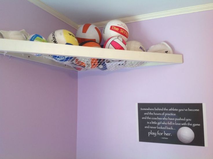 there is a shelf with balls on it