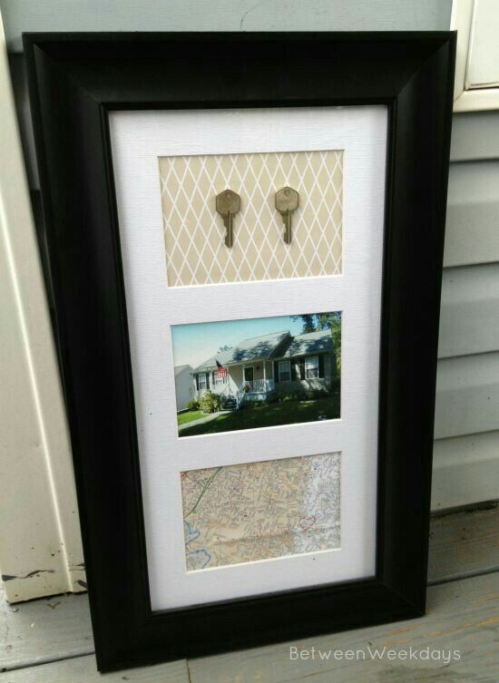 two pictures are hanging on the wall in front of a window with shutters and white trim