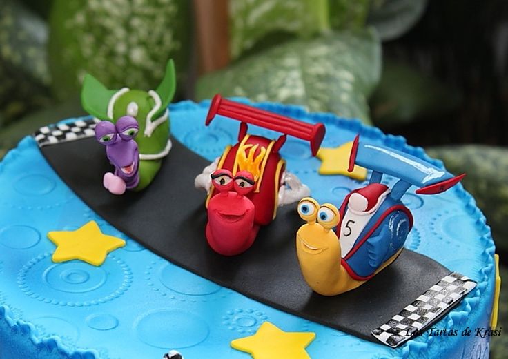 a birthday cake with cars and planes on it