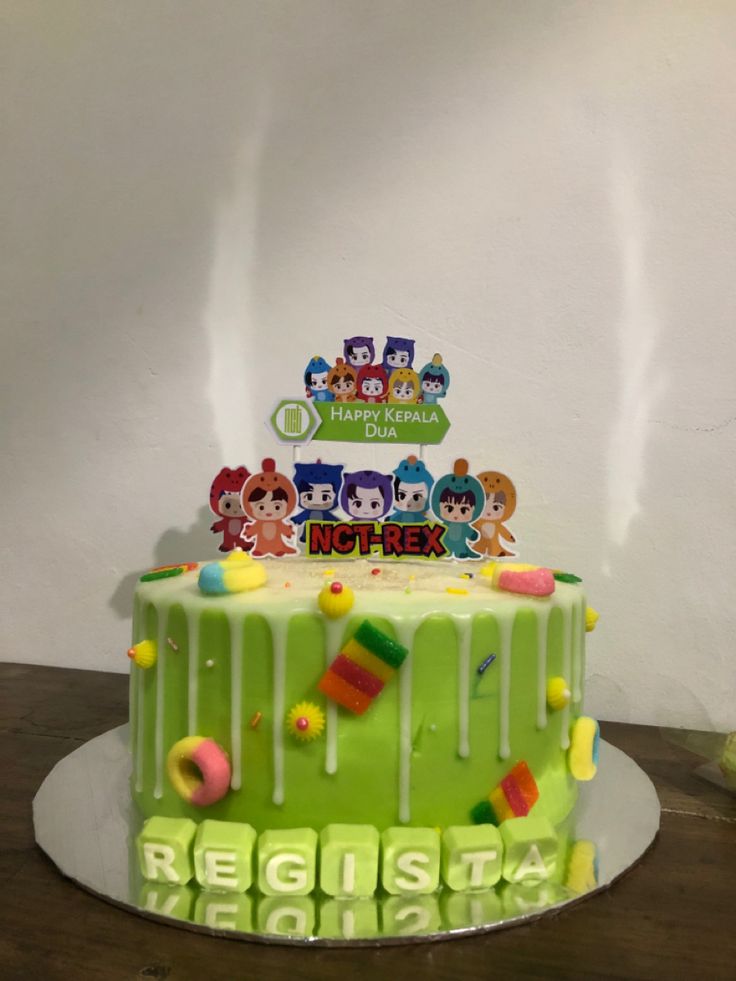 a birthday cake decorated with gummy bears