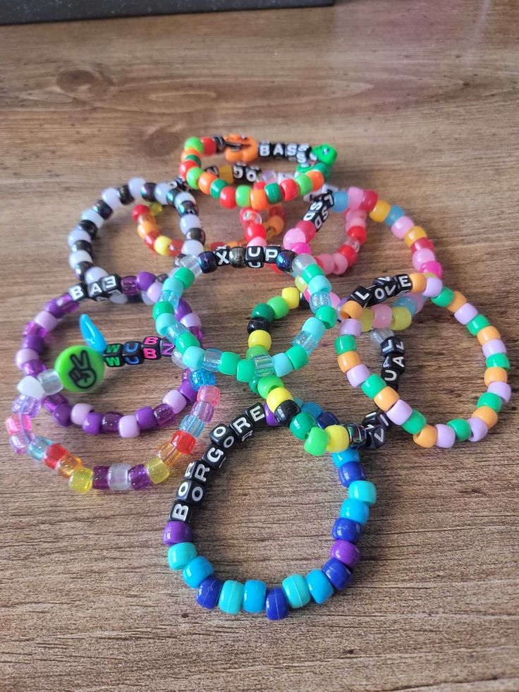 Random assortment of kandi bracelets. Cheap Rave Style Beaded Bracelets For Festivals, Rave Kandi Bracelets Ideas, Rave Jewelry, Diy Kandi Bracelets, Bracelet Pack, Diy Kandi, Kandi Bracelets, Kandi Patterns, Heart Bracelet