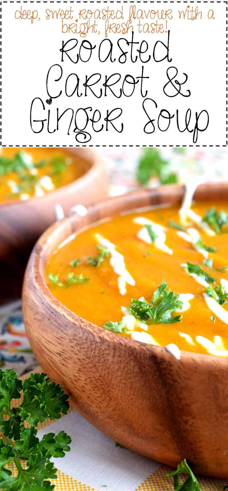 two bowls of roasted carrot and ginger soup with parsley on the side, text reads roasted carrot & ginger soup