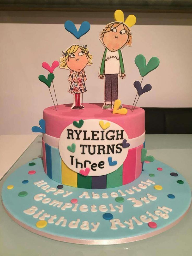 a birthday cake with an image of two people on top and the words, ryen turns three